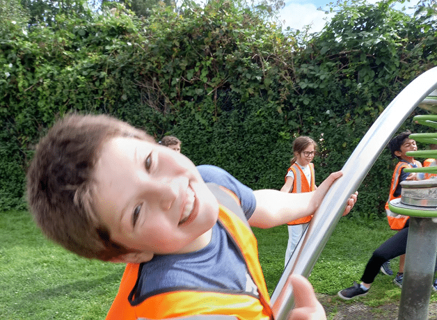 Park happy boy on seesaw